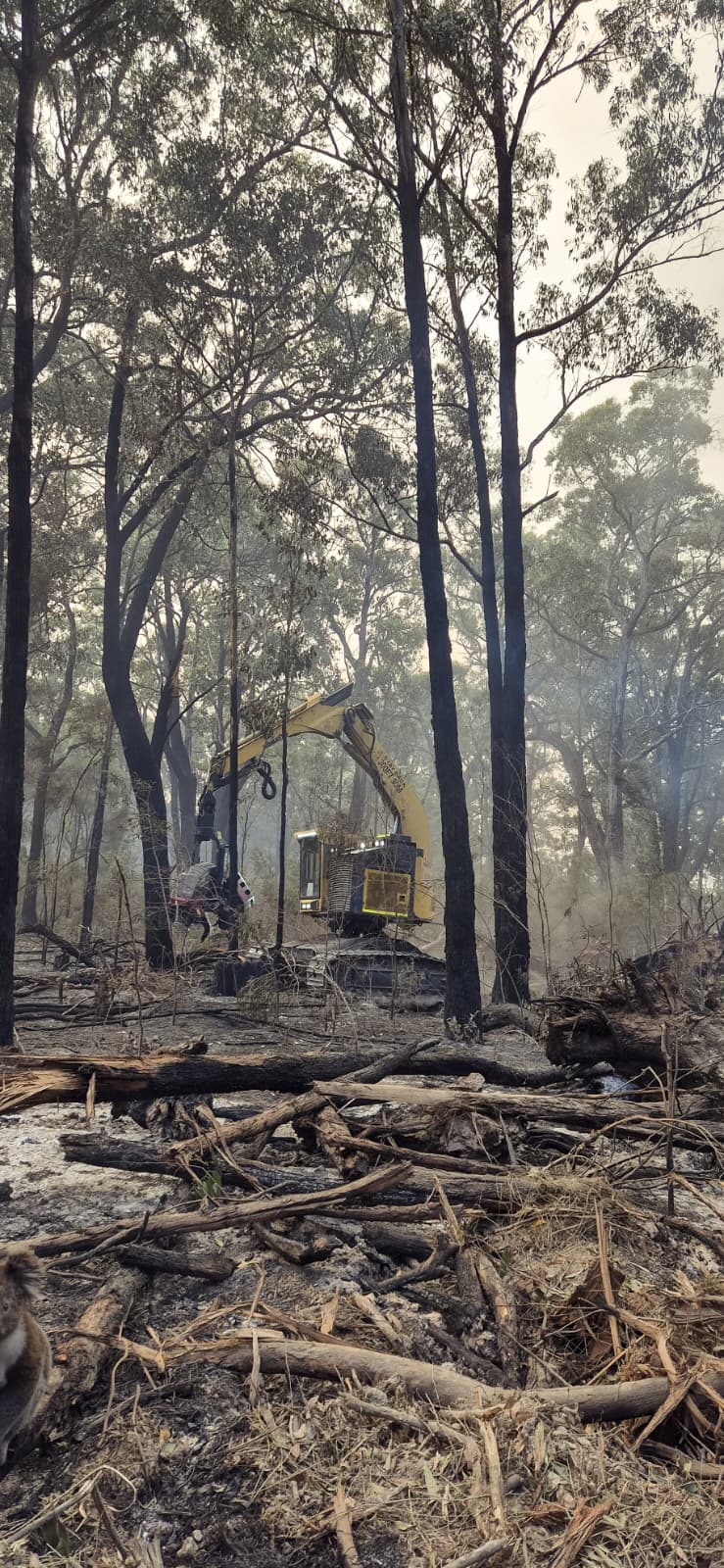 Machine working through heavy smoke on the fire ground