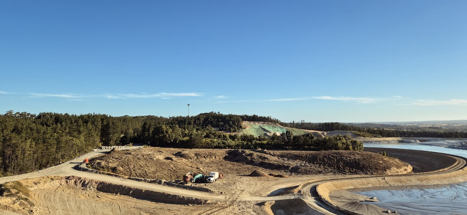 Cleared mine site pad with plantation edge, Victoria