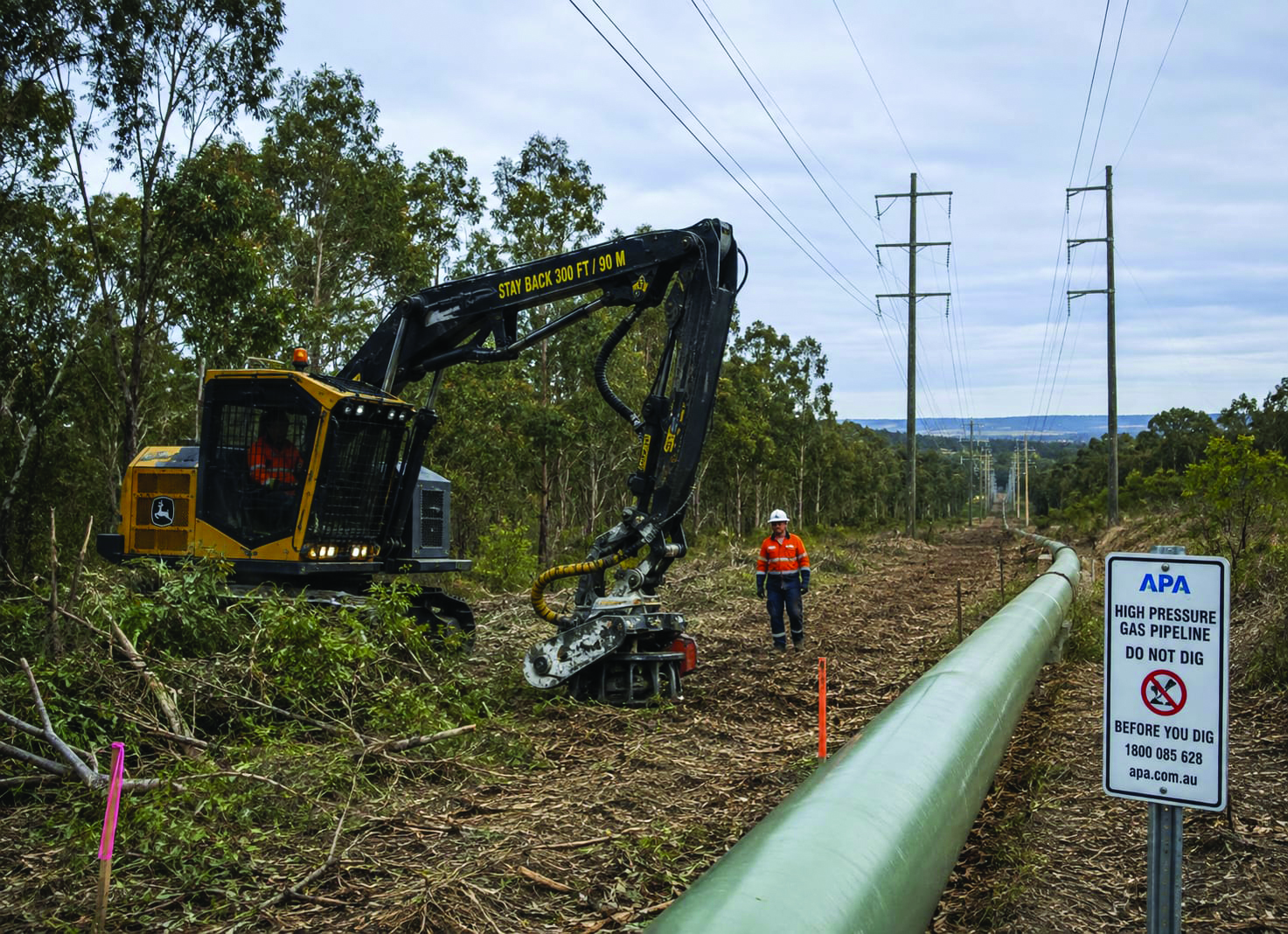Tracked mulcher clearing vegetation along a high pressure gas pipeline easement